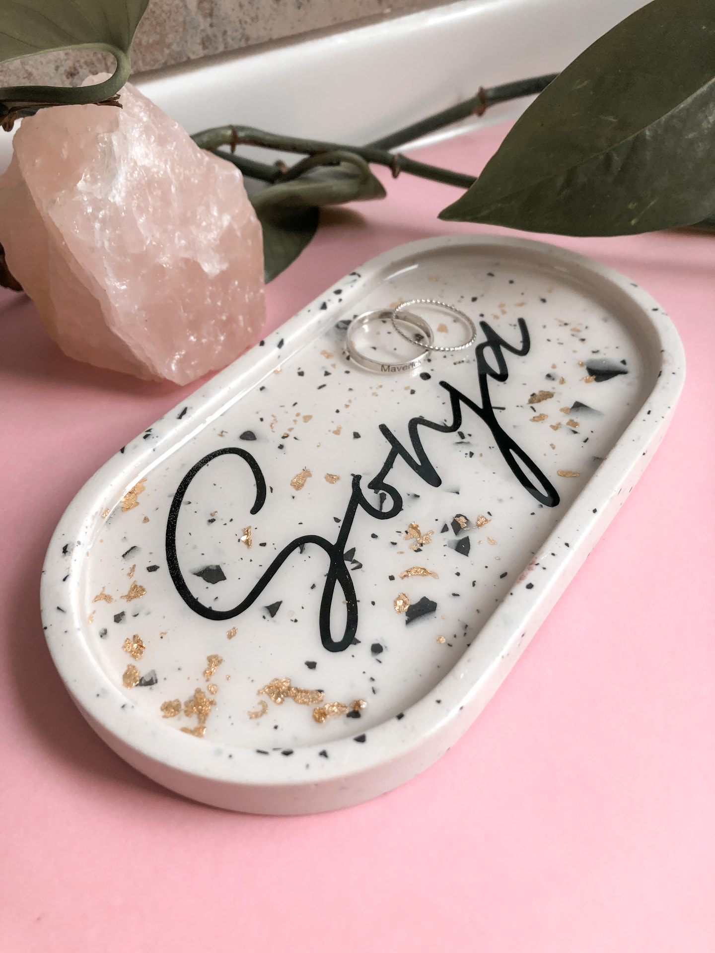 A handmade terrazzo trinket tray with gold flecks